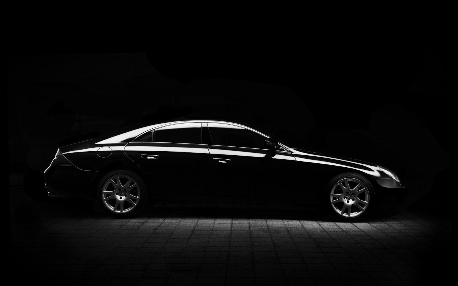 Black executive sedan silhouette used for limo and chauffeur dispatch and booking service