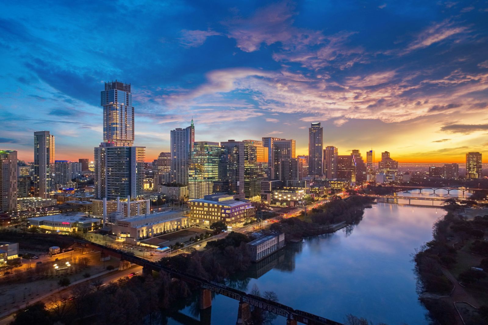 Austin, Texas skyline reflected in the river at sunset