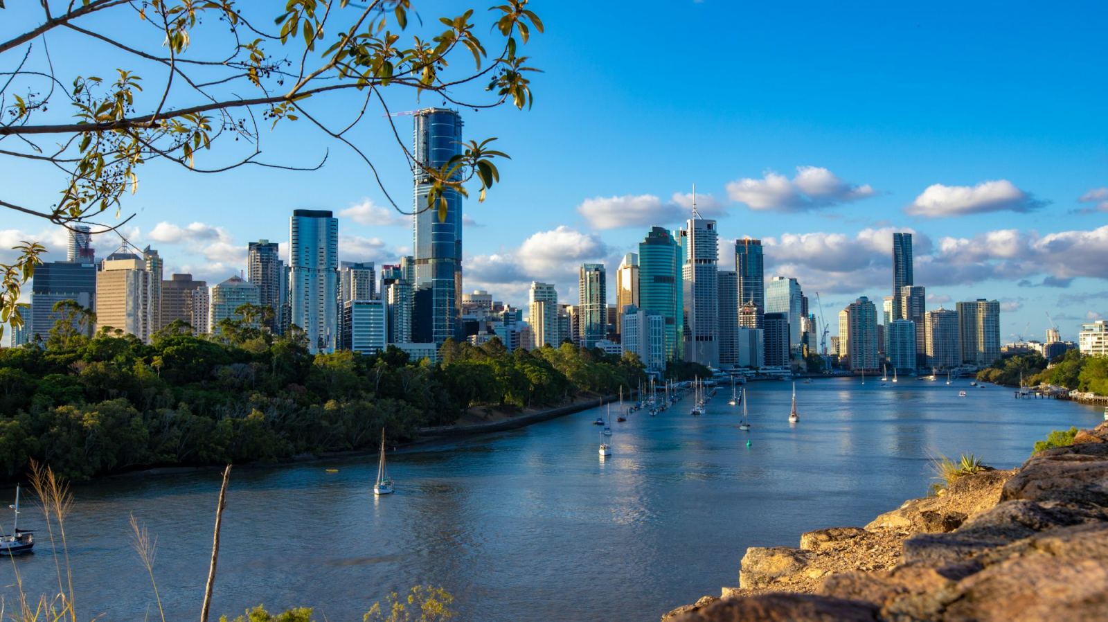 Brisbane skyline and river with sailboats on a clear day