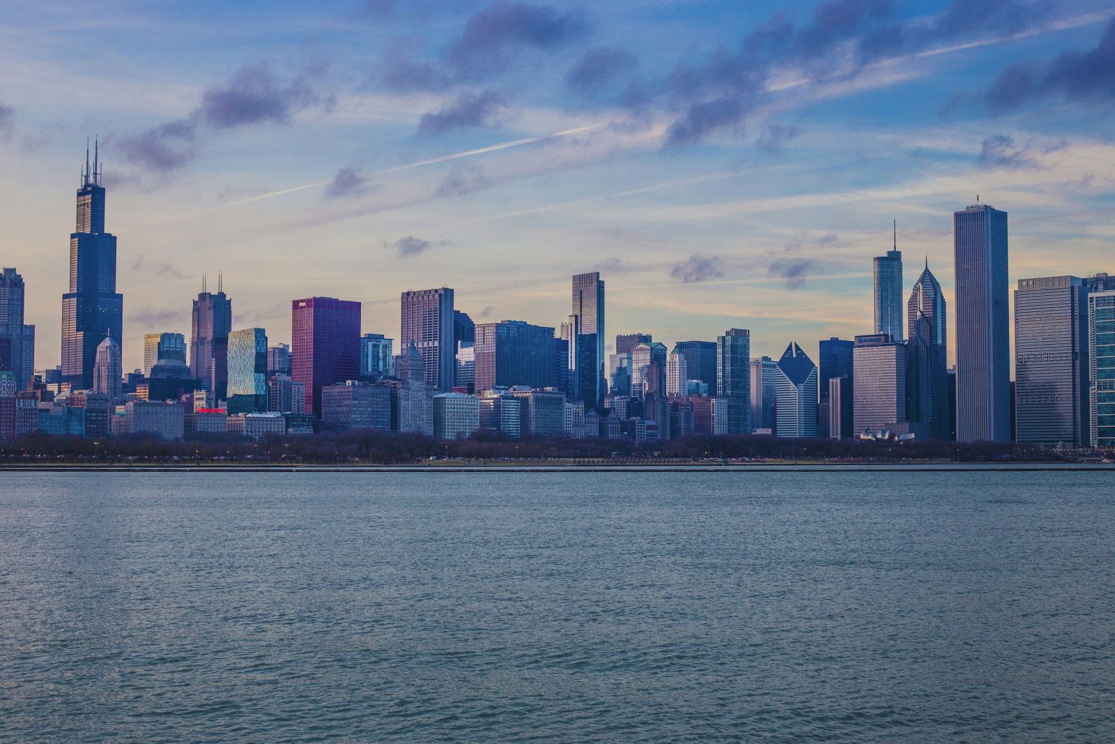Chicago skyline at dusk viewed across Lake Michigan