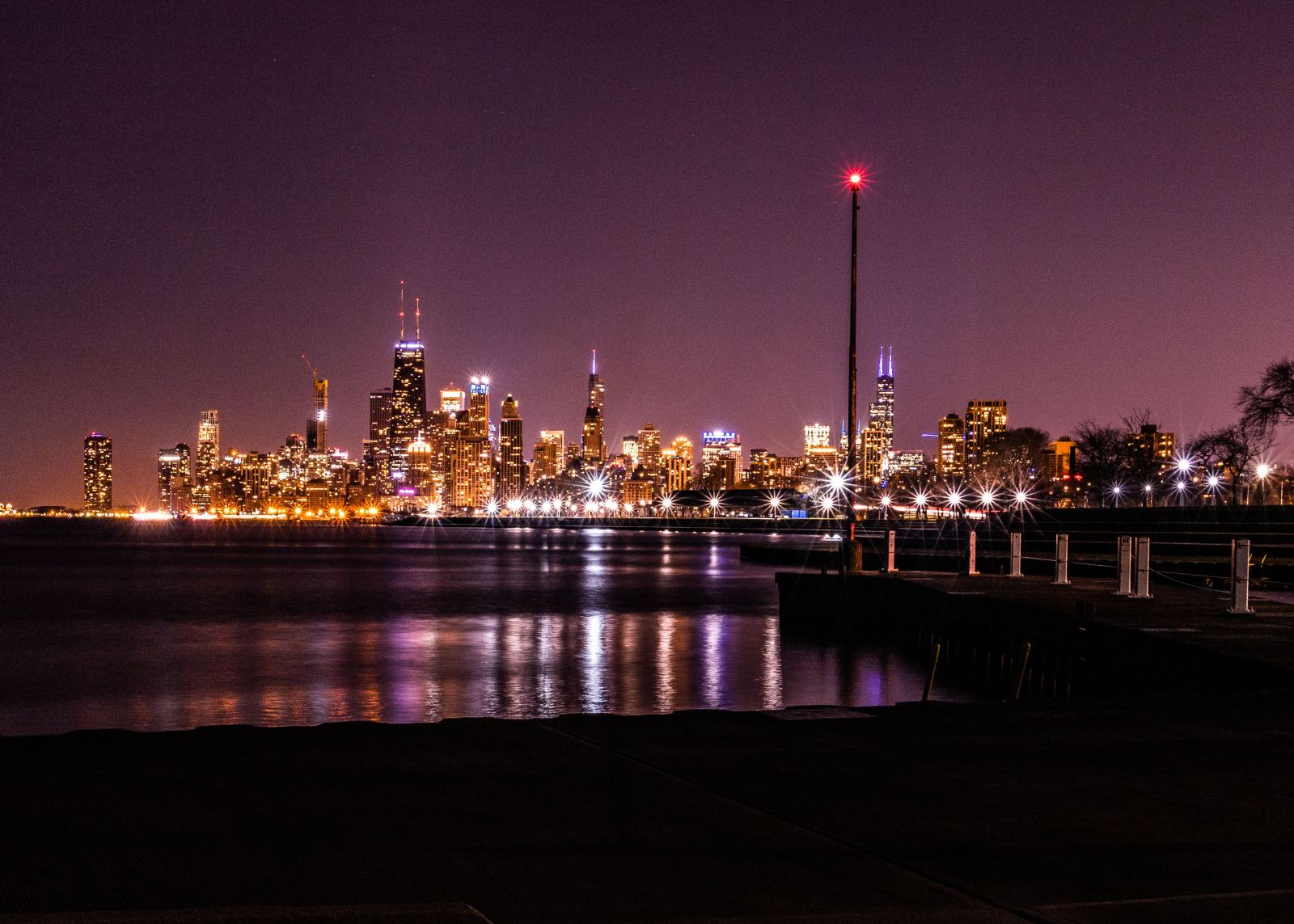 Chicago skyline illuminated at night along the lakefront