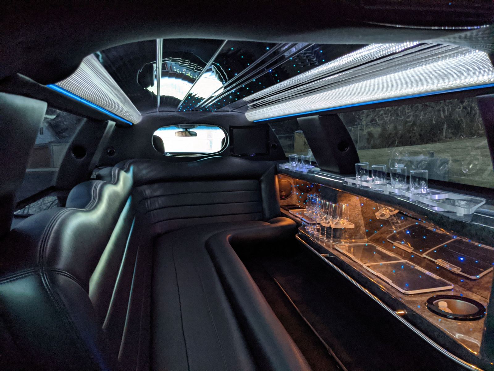 Limousine interior with glassware and ambient LED lighting
