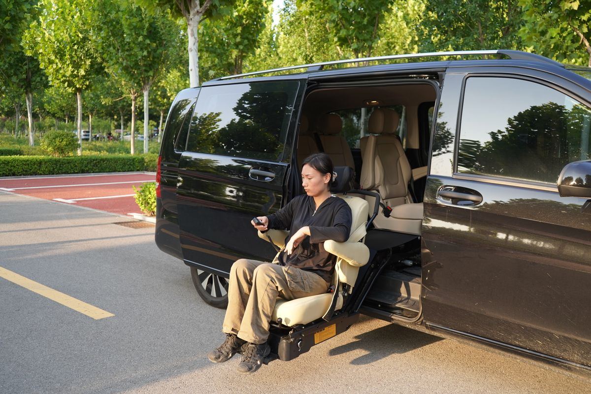 Wheelchair-accessible van with a fold-out lift chair for patient transport