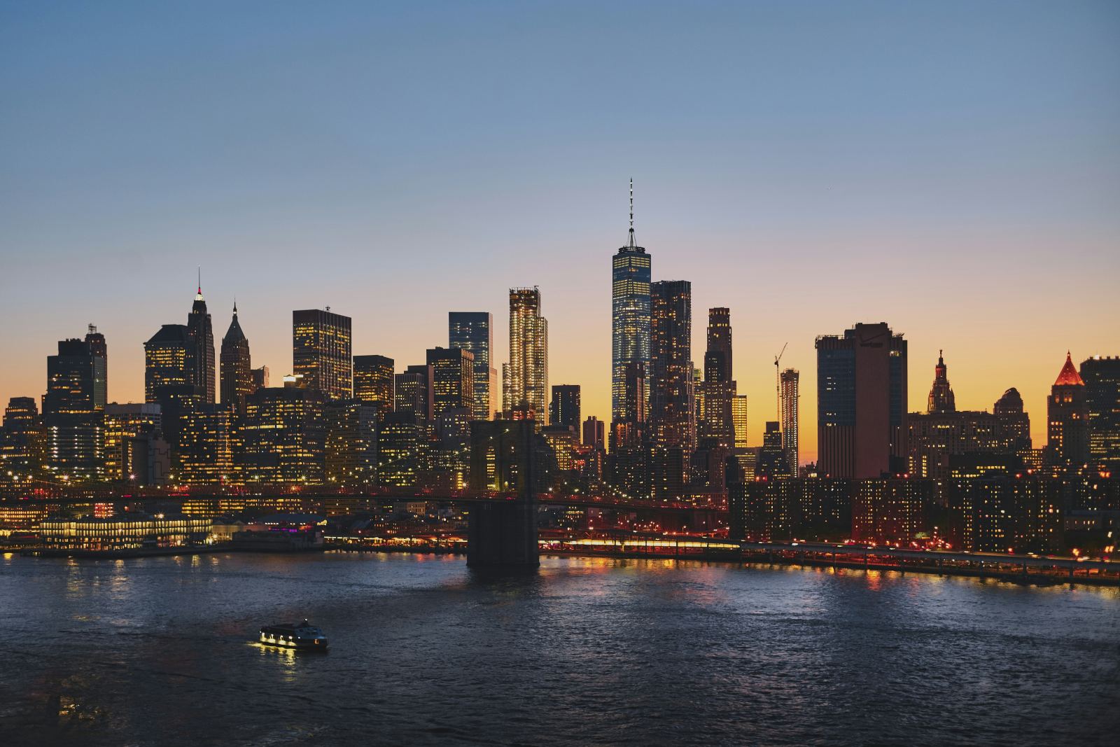 New York City skyline and Brooklyn Bridge at sunset