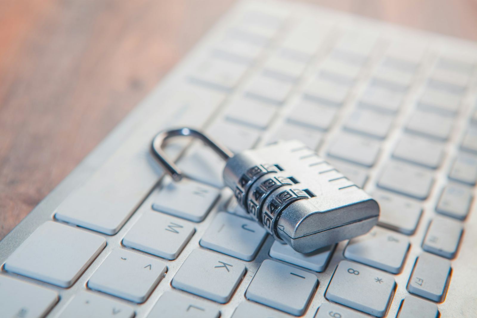 Combination padlock resting on a computer keyboard