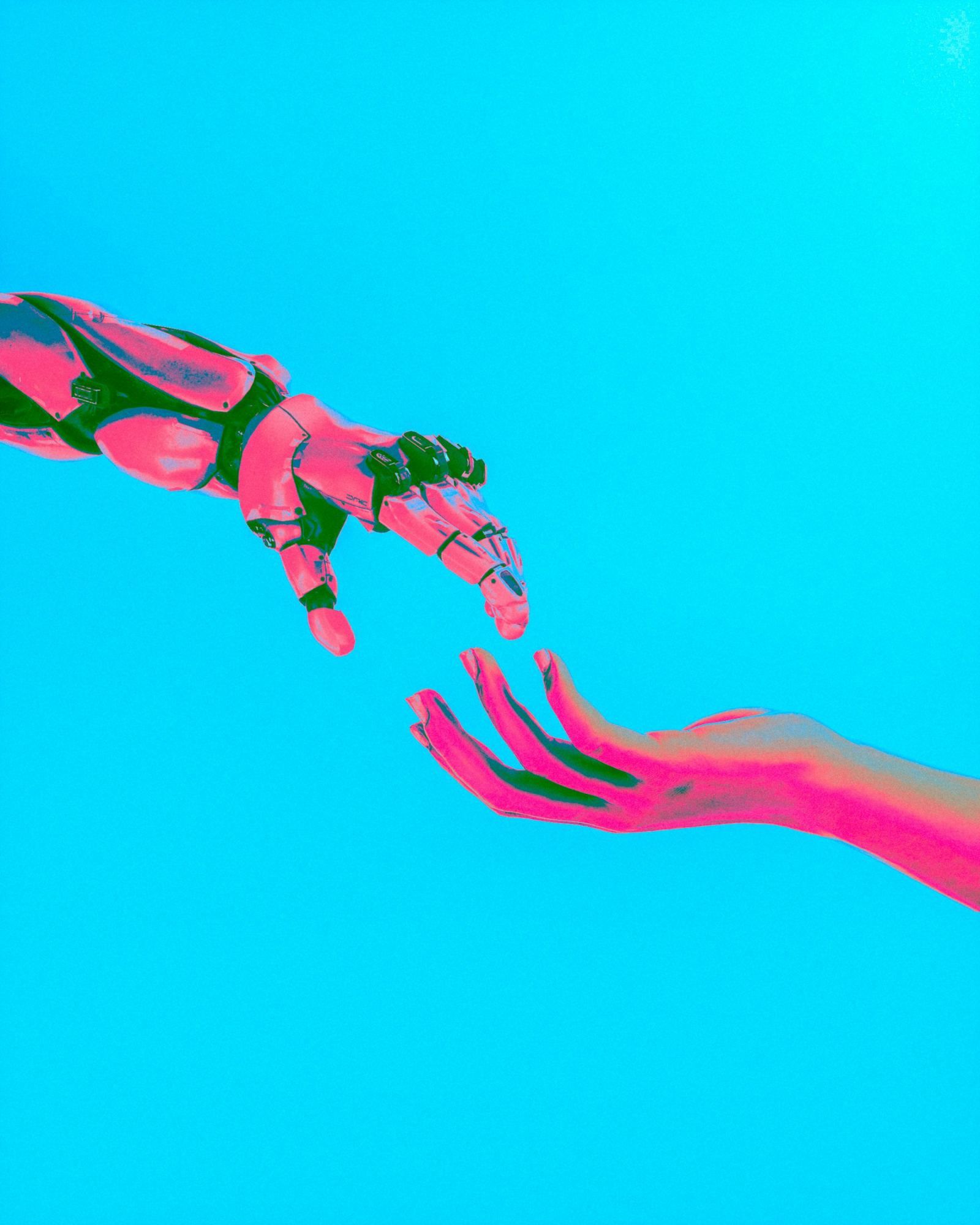 Stylized robotic hand and human hand reaching toward each other in vivid pink and cyan tones