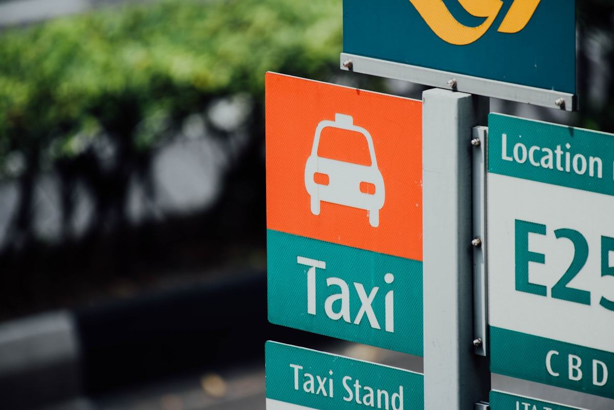 Taxi stand wayfinding sign with a car icon