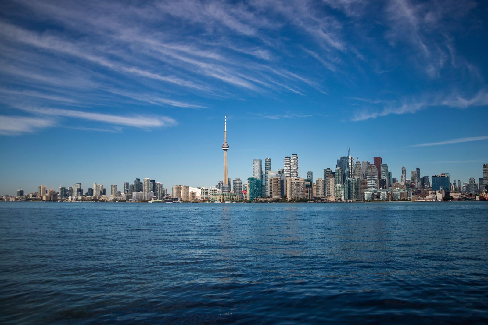 Toronto skyline and CN Tower viewed across the water on a clear day